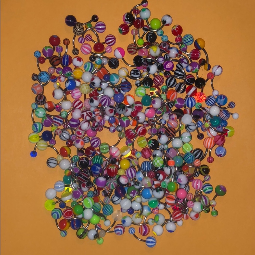 Lot of belly button rings unknown material